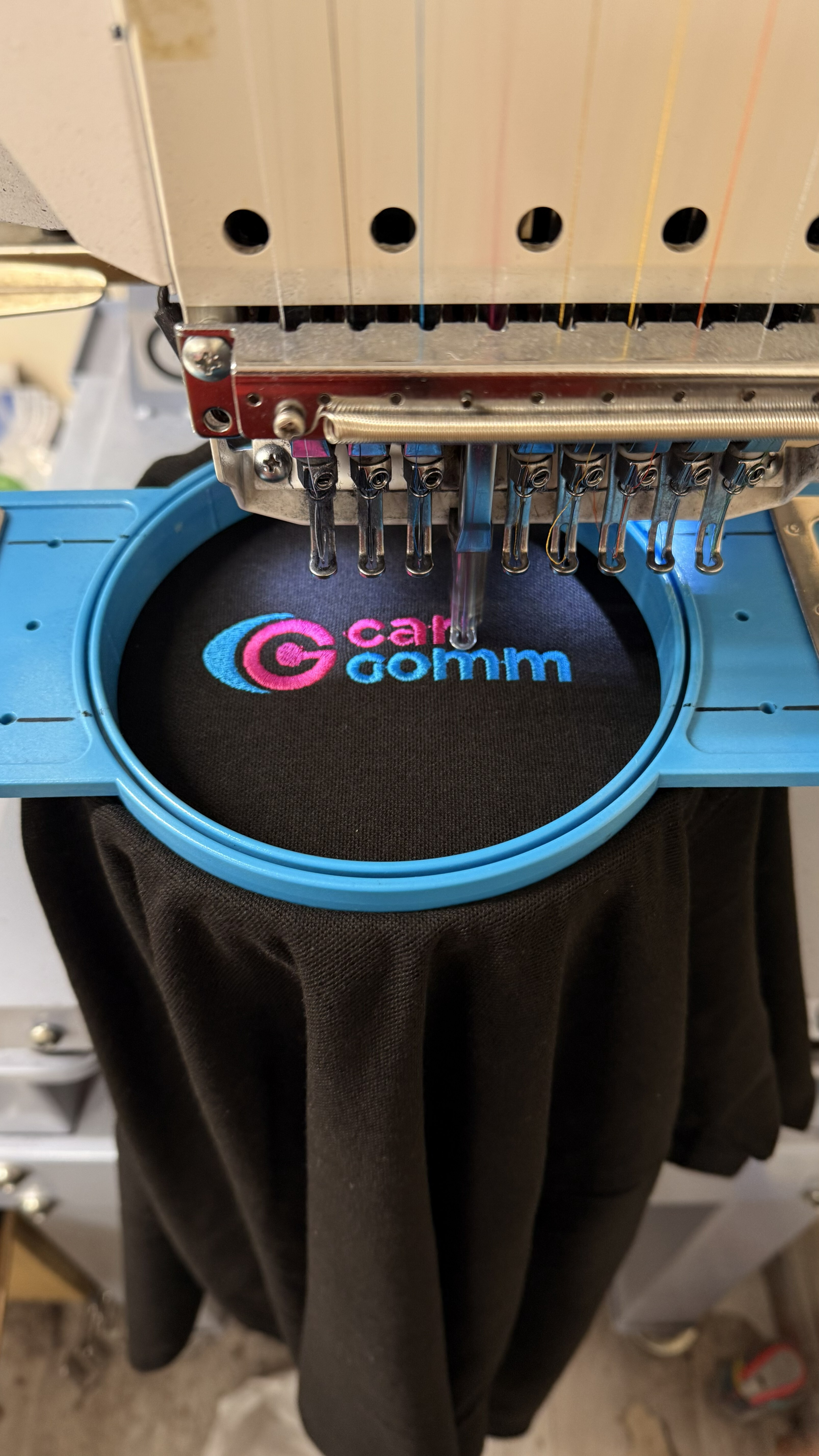 Carr Gomm Helensbugh embroidered logo on a black polo shirt