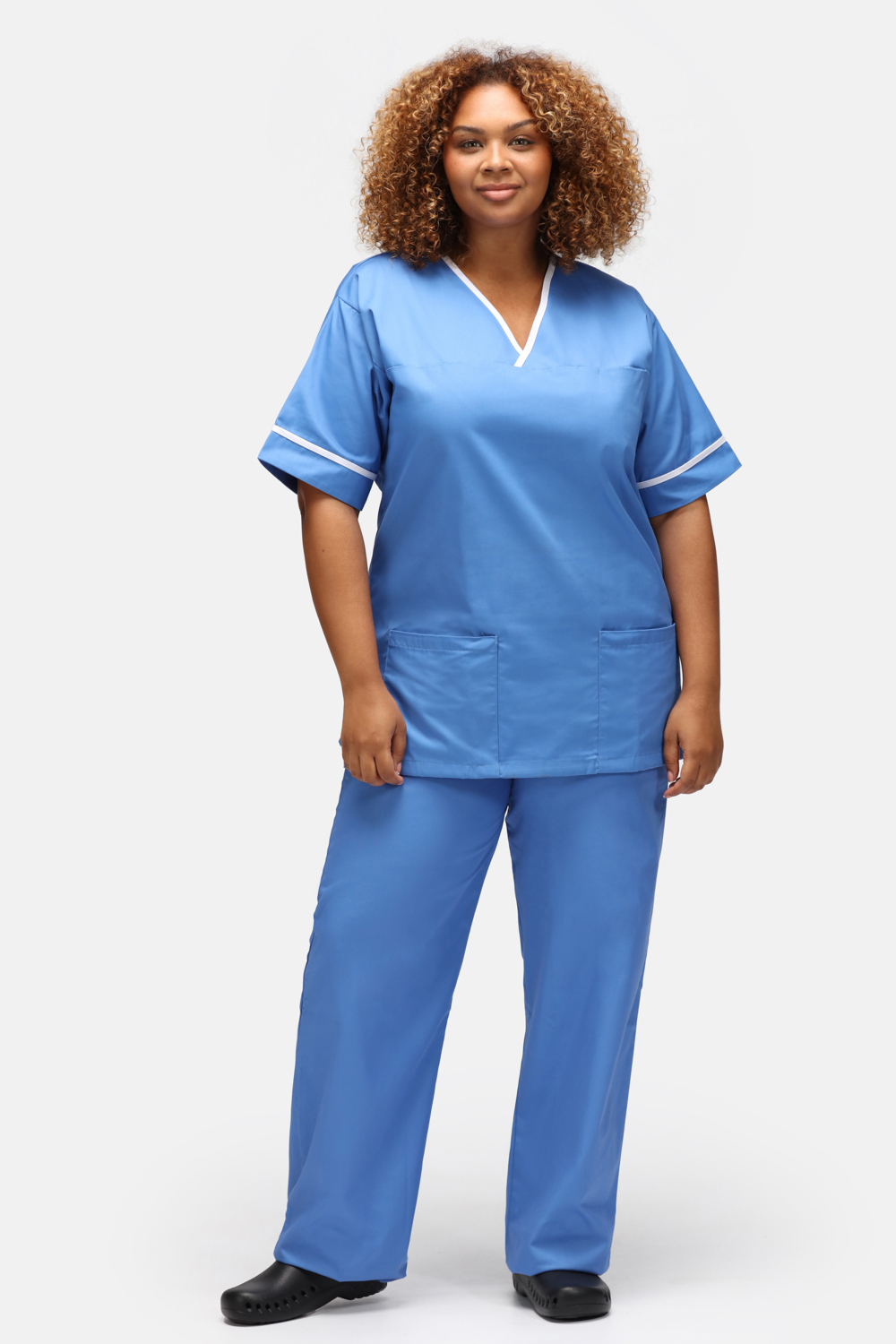Healthcare nurse wearing a smart scrub suit with contrast trim